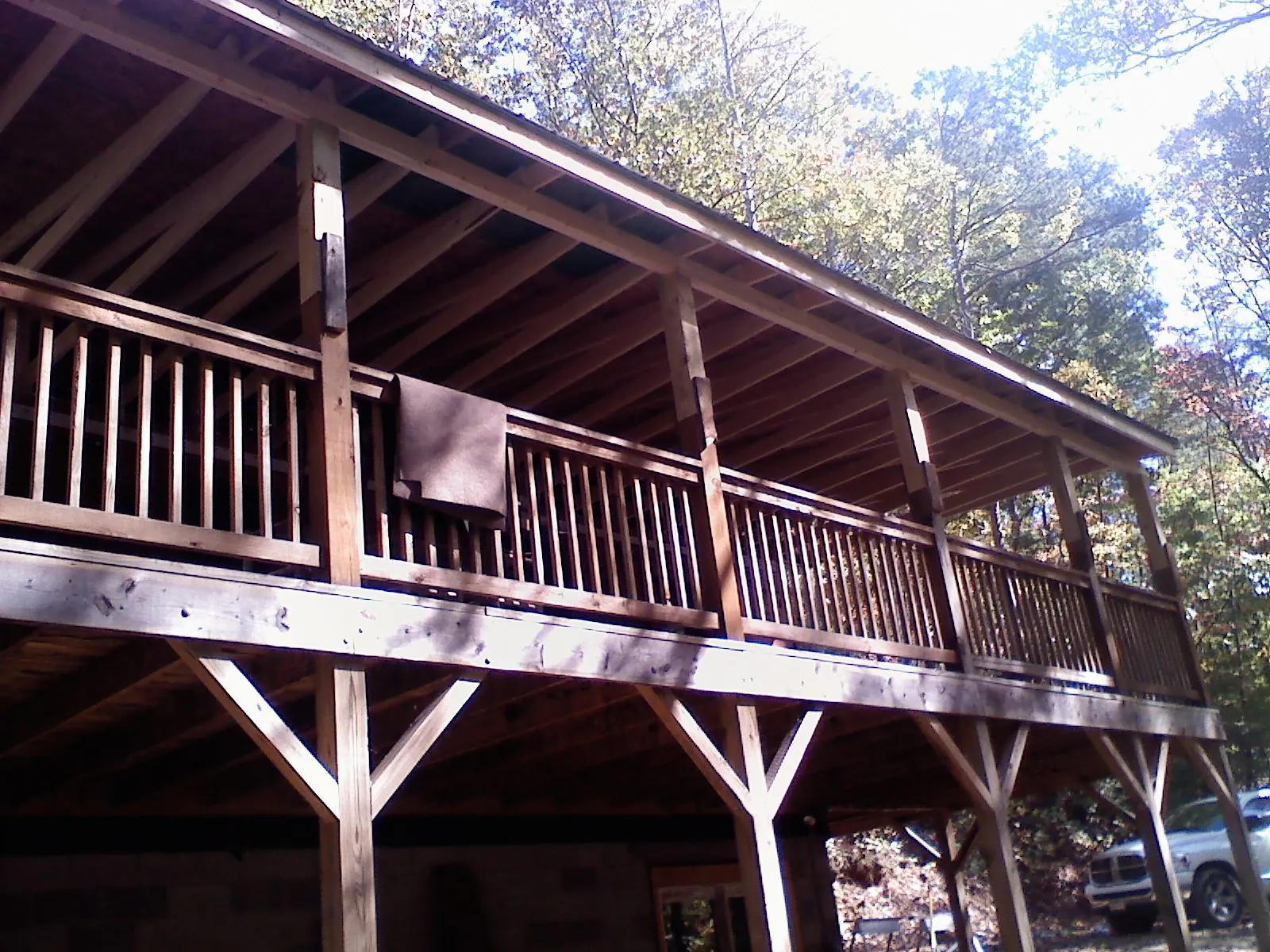 Timber framing under a new elevated porch and deck — Roof Leak Repair in Manor by Roofing Brothers
